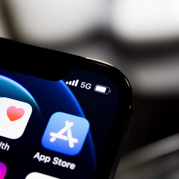 Upclose shot of an Apple iphone displaying 5G